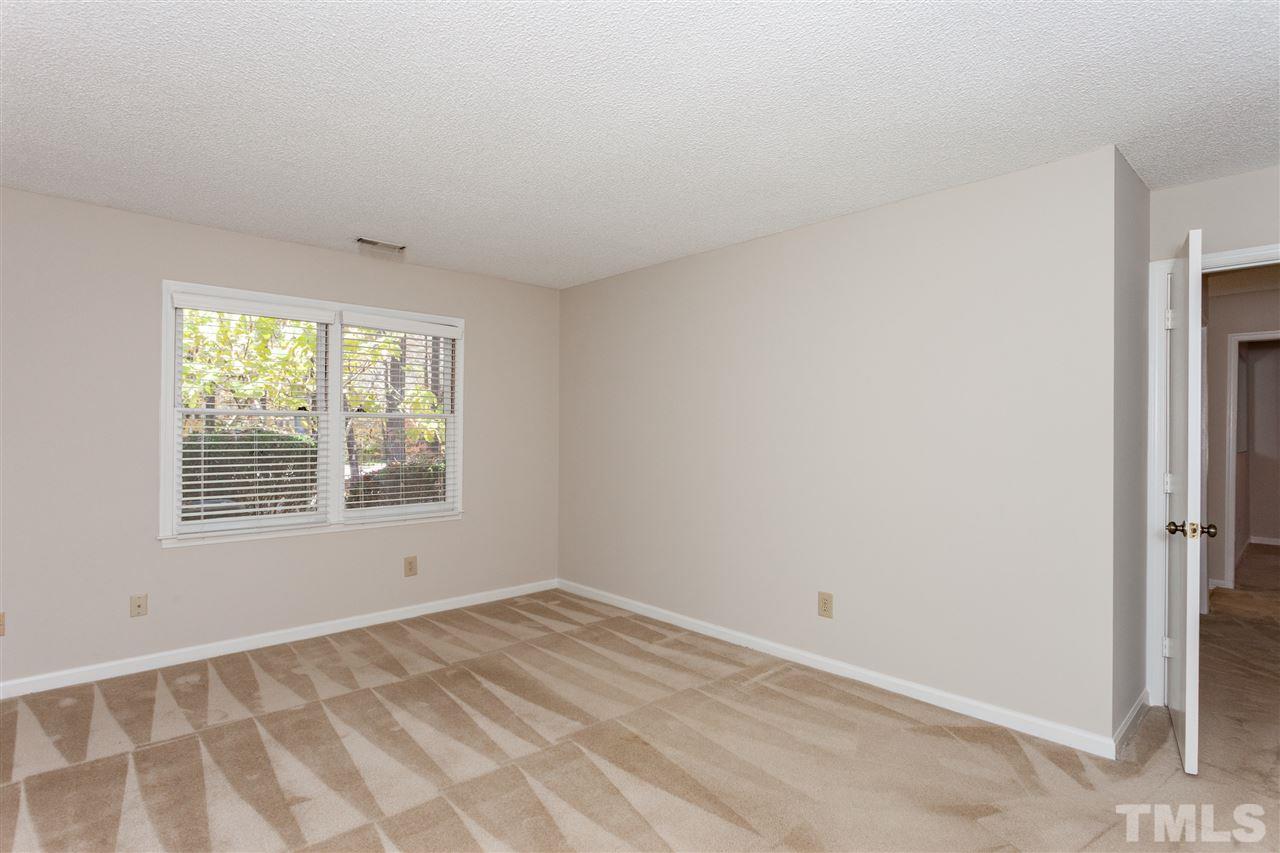 8027 Brown Bark Place Raleigh, NC 27615 - Photo 8 of 19 an empty room with a window