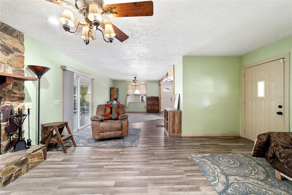 15755 Southwest 90th Avenue Dunnellon, FL 34432 - Photo 11 of 55 a bedroom with furniture and wooden floor