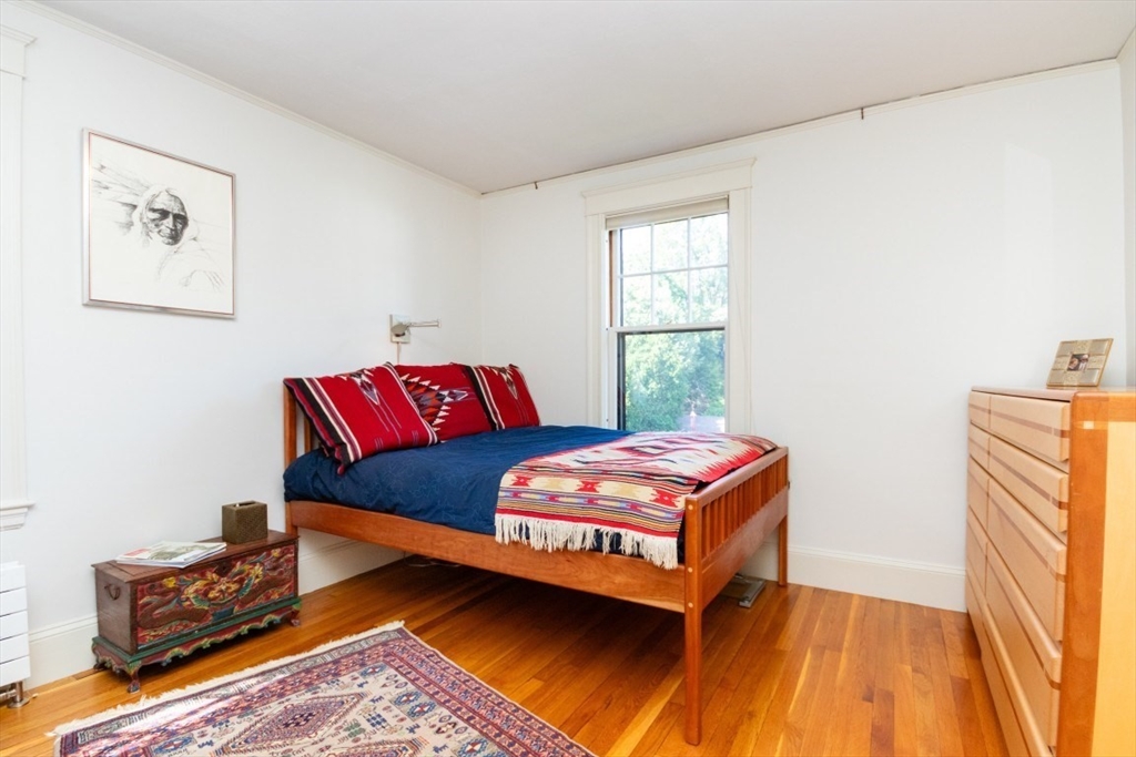 4 Charlotte Road Newton, MA 02459 - Photo 17 of 32 a bedroom with a bed and wooden floor
