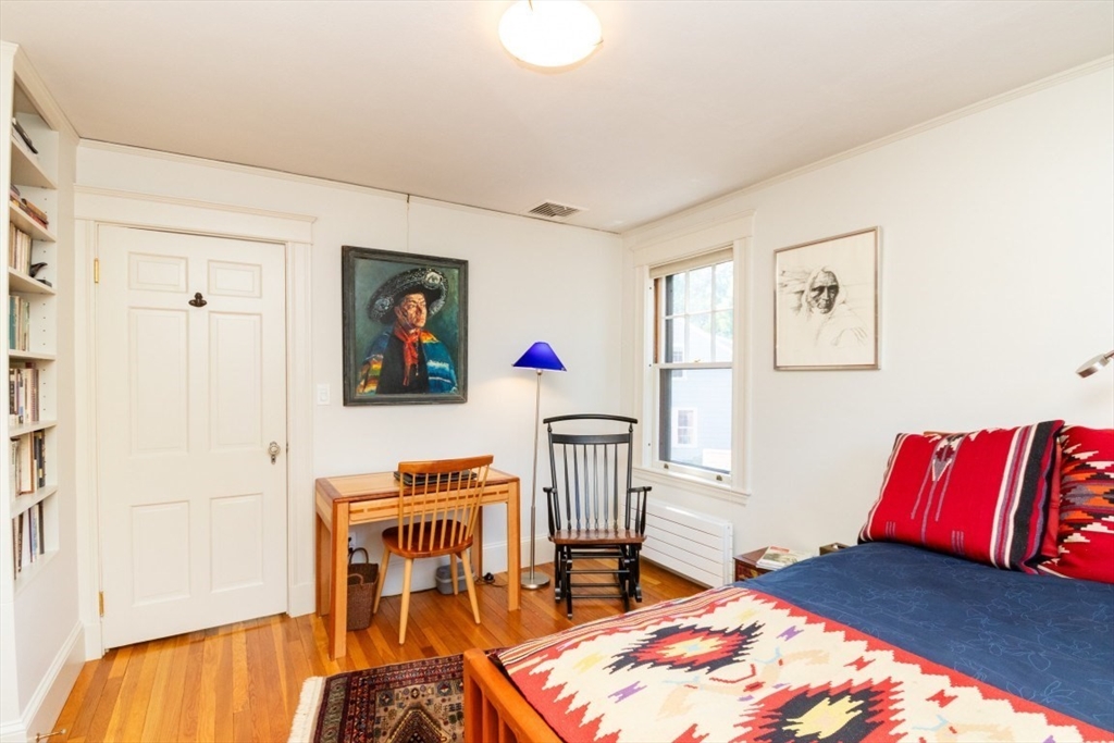 4 Charlotte Road Newton, MA 02459 - Photo 18 of 32 a bedroom with a bed and wooden floor