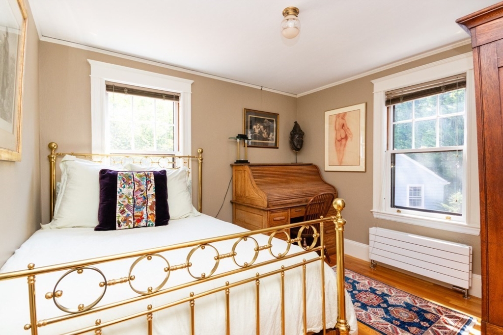 4 Charlotte Road Newton, MA 02459 - Photo 21 of 32 a bedroom with a bed and wooden floor