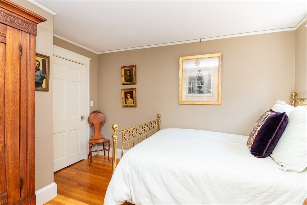 4 Charlotte Road Newton, MA 02459 - Photo 22 of 32 a bedroom with a bed and a chair