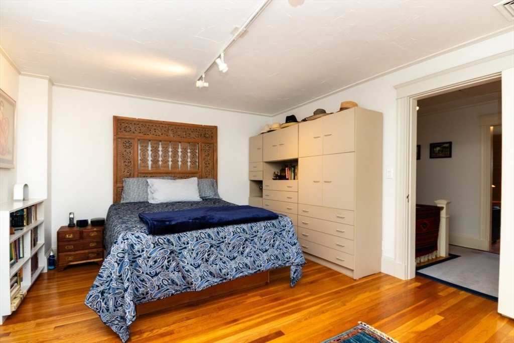 4 Charlotte Road Newton, MA 02459 - Photo 23 of 32 a bedroom with a large bed and a window
