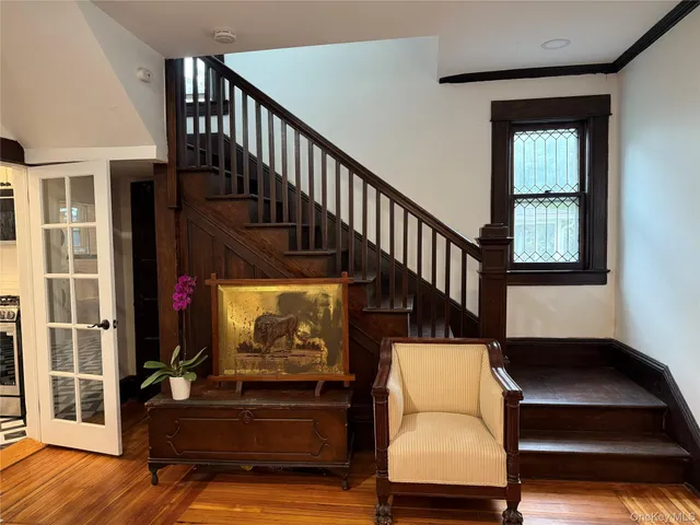a view of entryway livingroom and hall with wooden floor