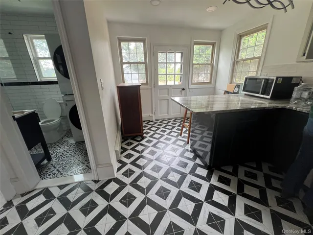 a view of a dining room with a table and chair