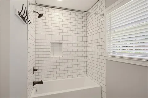 a bathroom with a toilet a sink and a mirror
