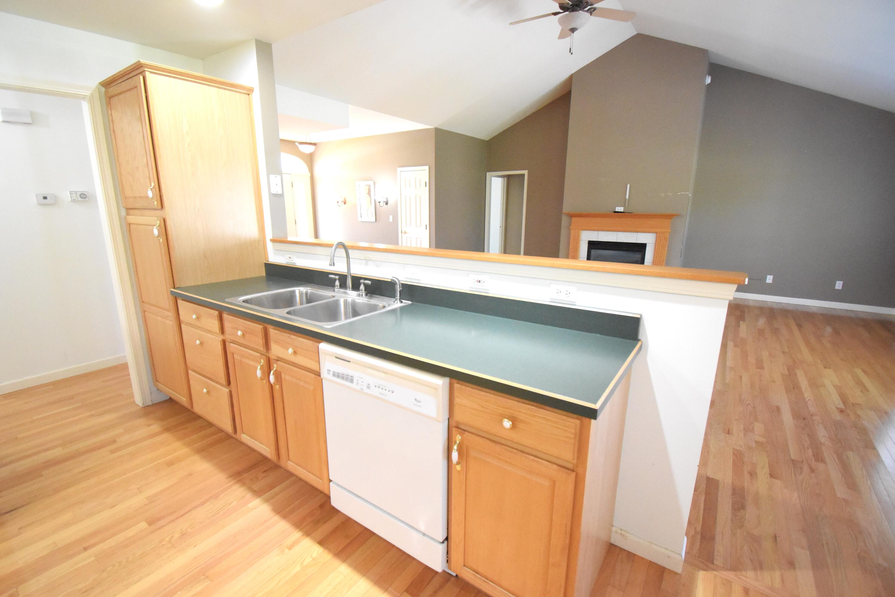 522 Pheasant Run Rensselaer, IN 47978 - Photo 28 of 55 a kitchen with stainless steel appliances granite countertop a sink and a refrigerator