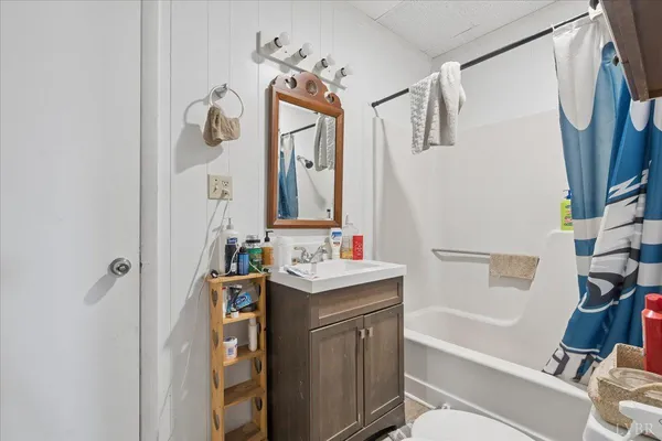 a bathroom with a sink a toilet and a bathtub