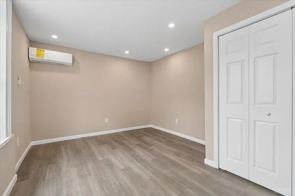 a room with furniture and a flat screen tv