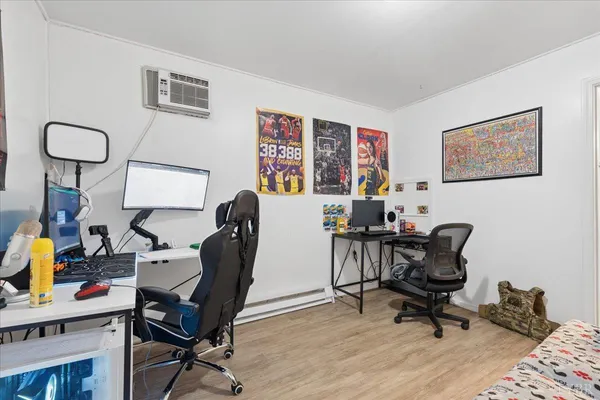 a bedroom with a bed and a dresser