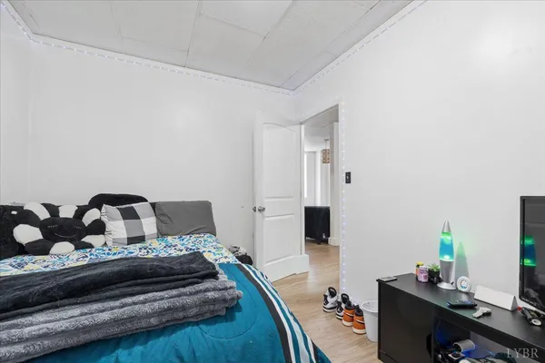 a kitchen with stainless steel appliances kitchen island granite countertop a refrigerator stove and wooden cabinets