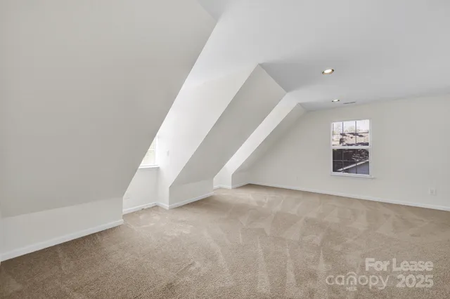 a view of an empty room with stairs