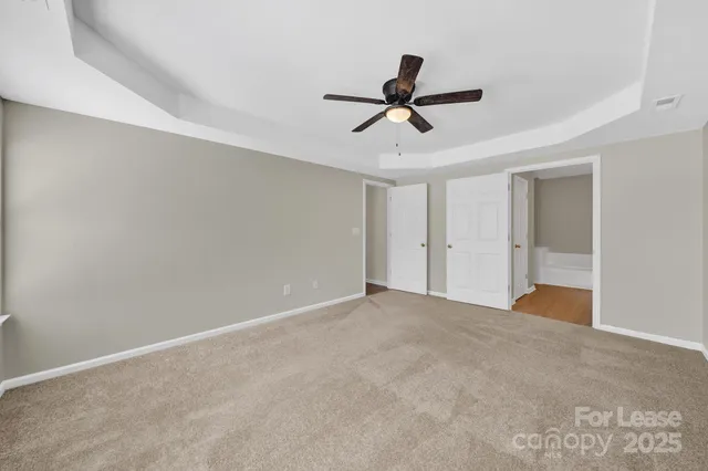 a view of a big room with carpet