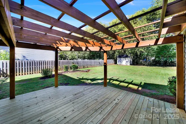 a view of a deck with a big yard