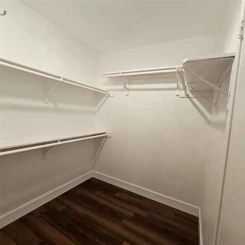 a view of an empty walk in closet