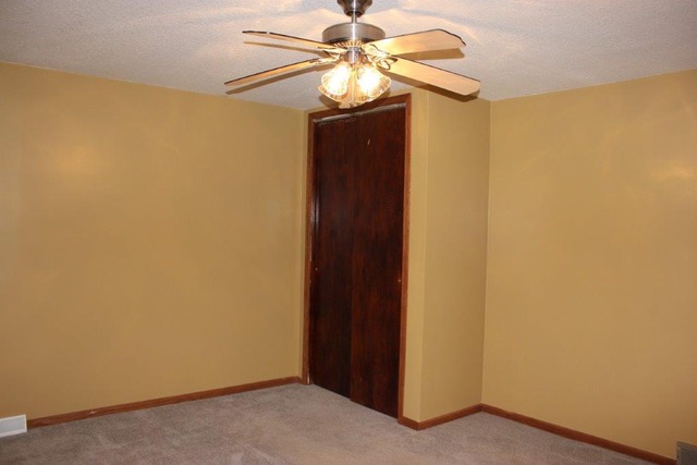 11830 Nelson Road Morrison, IL 61270 - Photo 8 of 15 a view of a hallway with a chandelier fan
