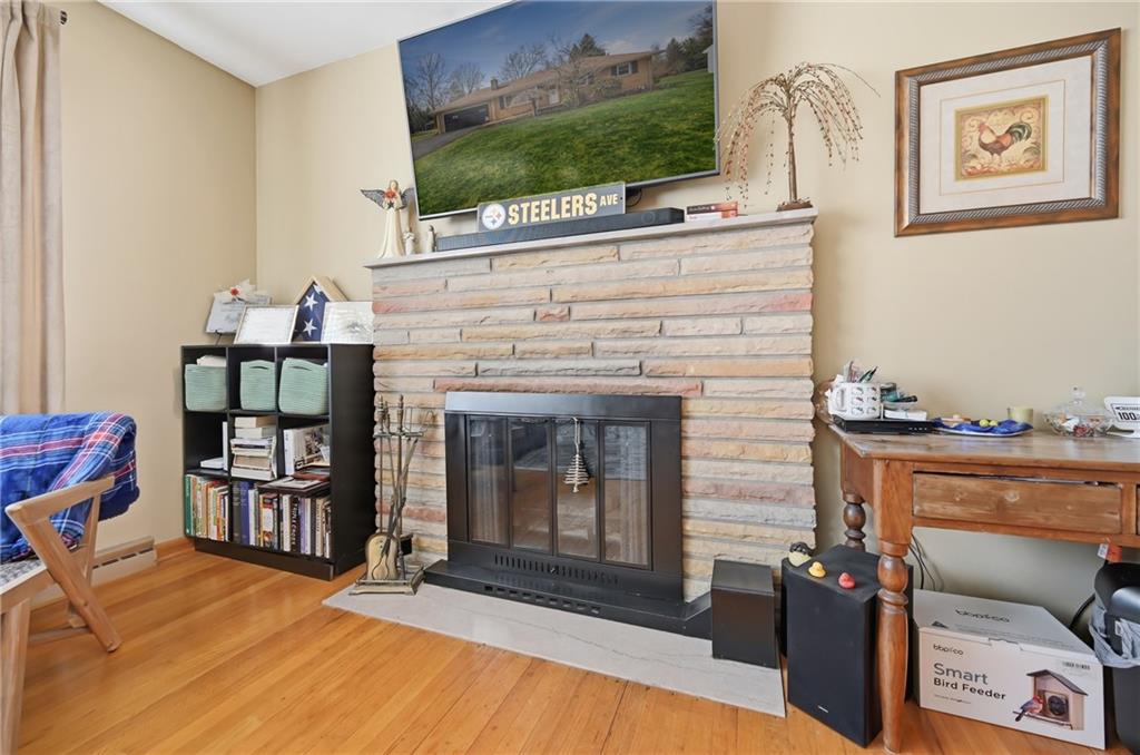 256 Donald Road Hermitage, PA 16148 - Photo 13 of 28 a living room with fireplace furniture and a flat screen tv