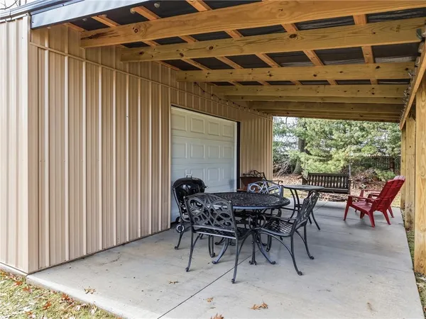a view of a dinning table and chairs in the patio