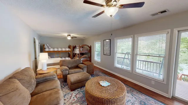 a living room with furniture and a rug