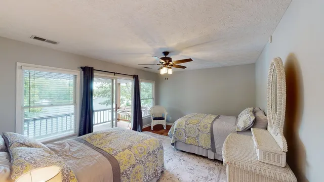 a bedroom with a large bed and a window