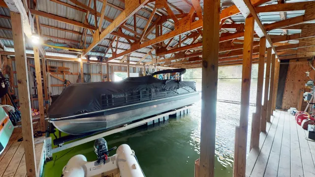a roof deck with table and chairs and wooden floor
