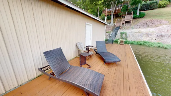 swimming pool view with a seating space