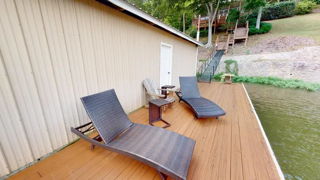 swimming pool view with a seating space