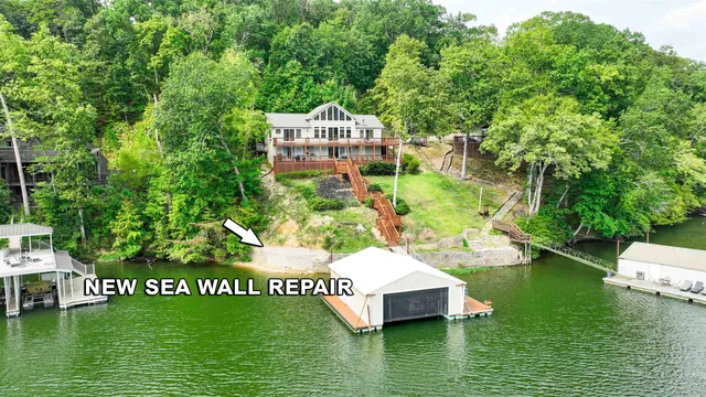 a view of house with garden space and sitting area