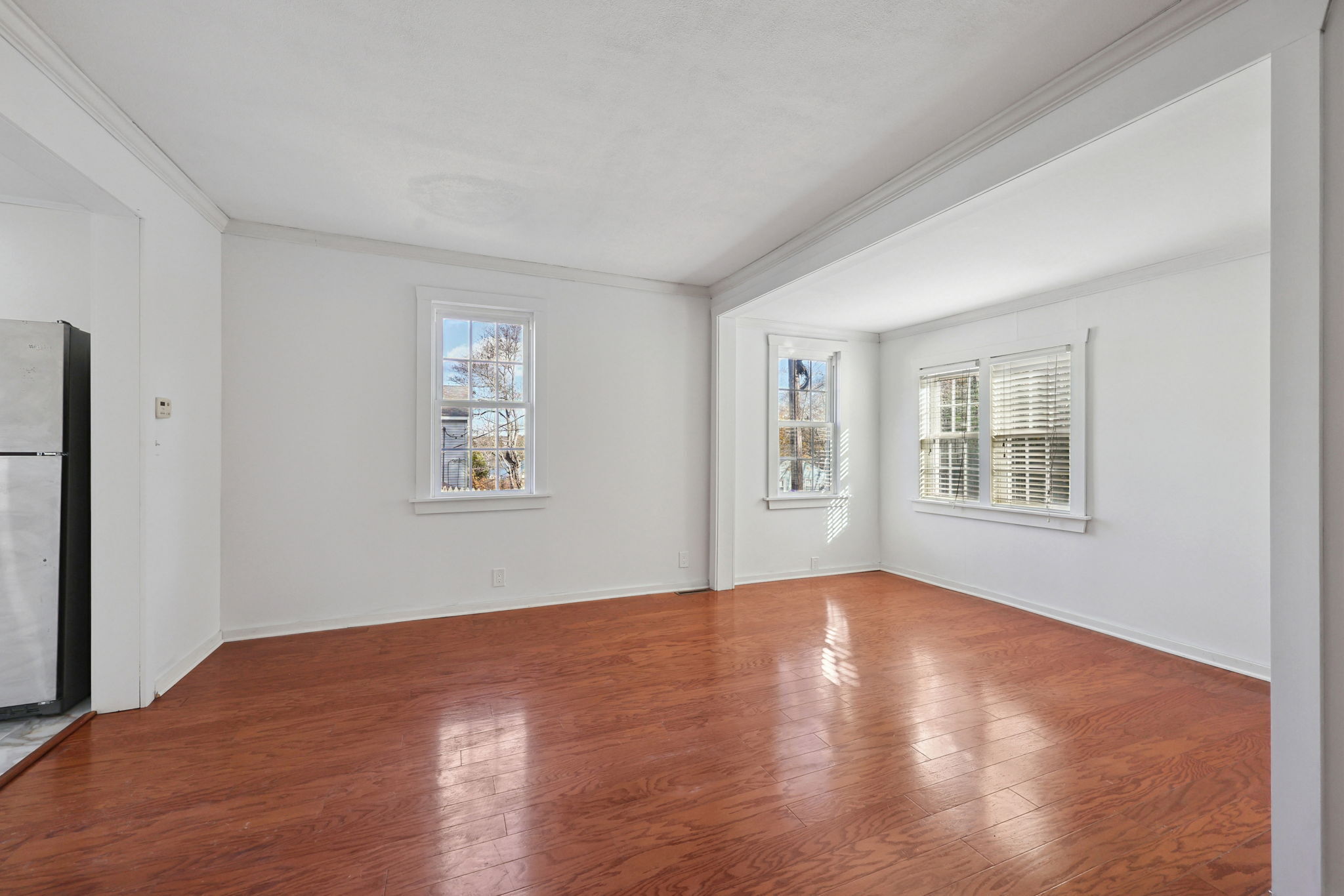 18 Lake Boulevard East Hampton, CT 06424 - Photo 4 of 31 a view of an empty room with window and wooden floor