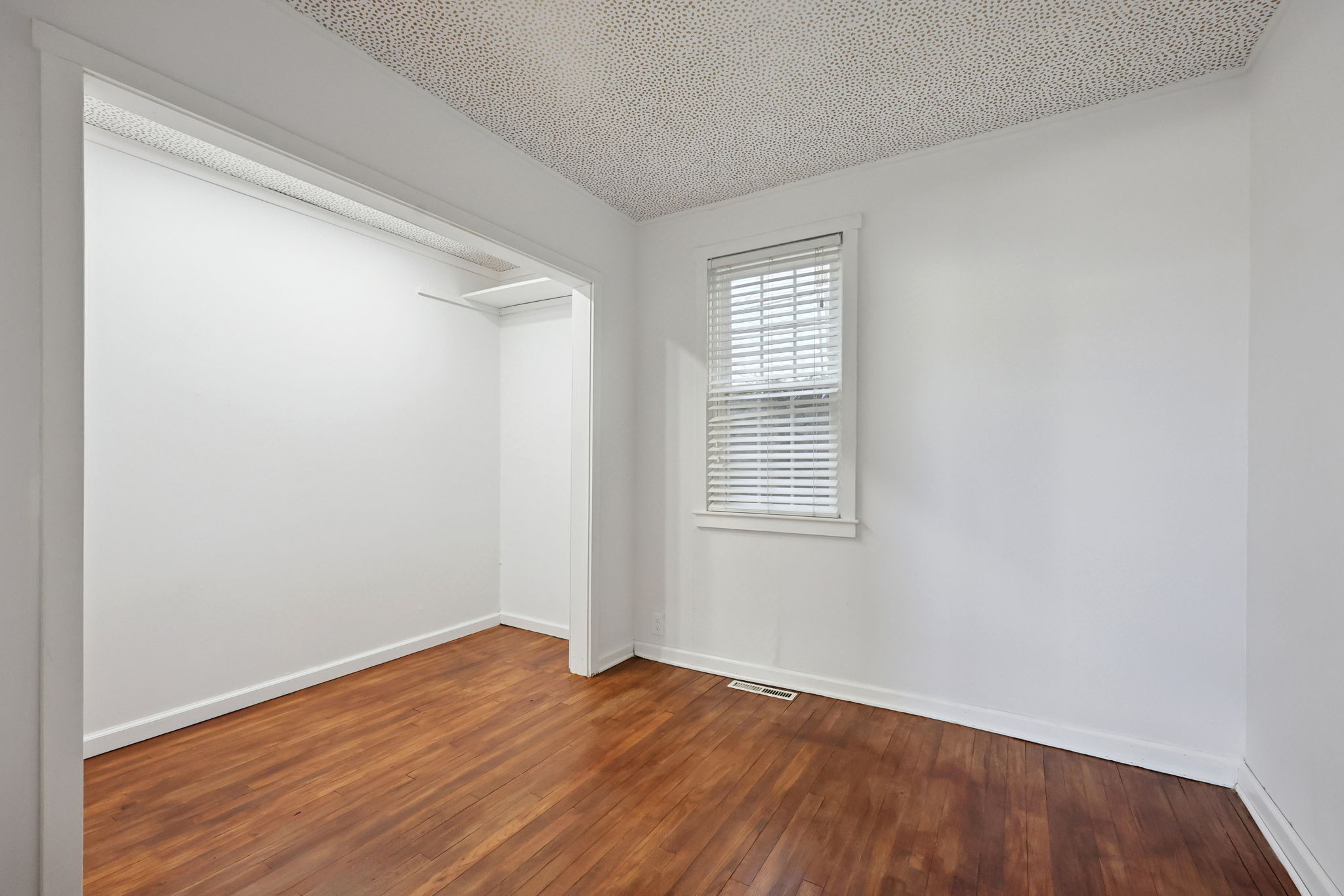 18 Lake Boulevard East Hampton, CT 06424 - Photo 7 of 31 an empty room with wooden floor and windows