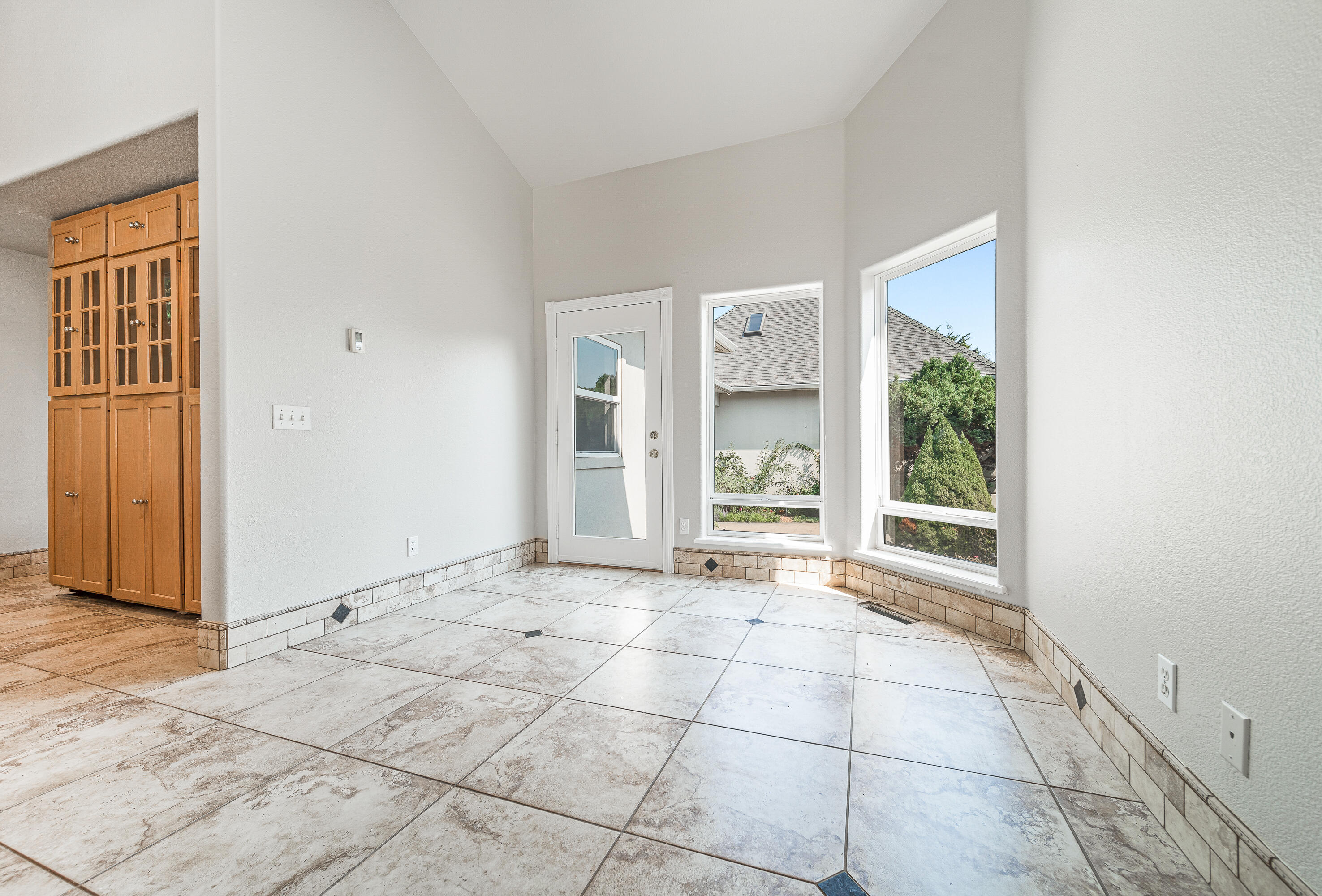 925 Anderson Creek Road Talent, OR 97540 - Photo 13 of 52 a view of an empty room with window and chandelier