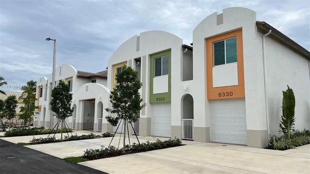 a front view of a house with street
