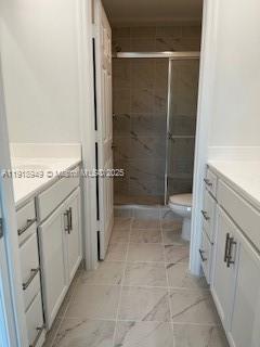 Davie Davie, FL 33314 - Photo 5 of 8 a bathroom with a granite countertop sink a toilet and a shower