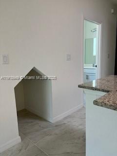 Davie Davie, FL 33314 - Photo 6 of 8 a room with a granite countertop sink and cabinets