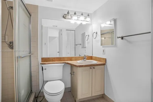 a view of empty room with wooden floor and window