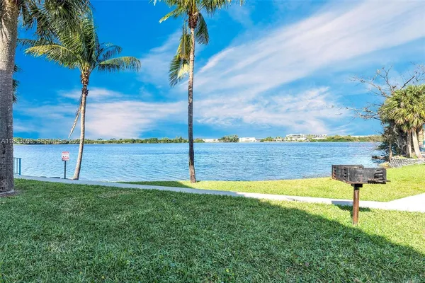 a brick building with trees in front of it
