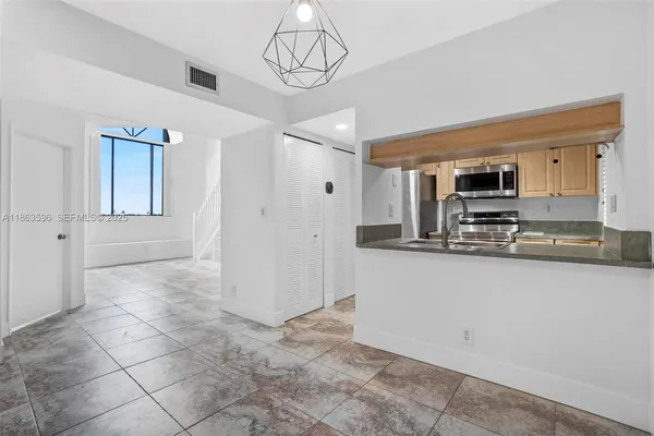 a view of a kitchen with a sink and dishwasher a kitchen view