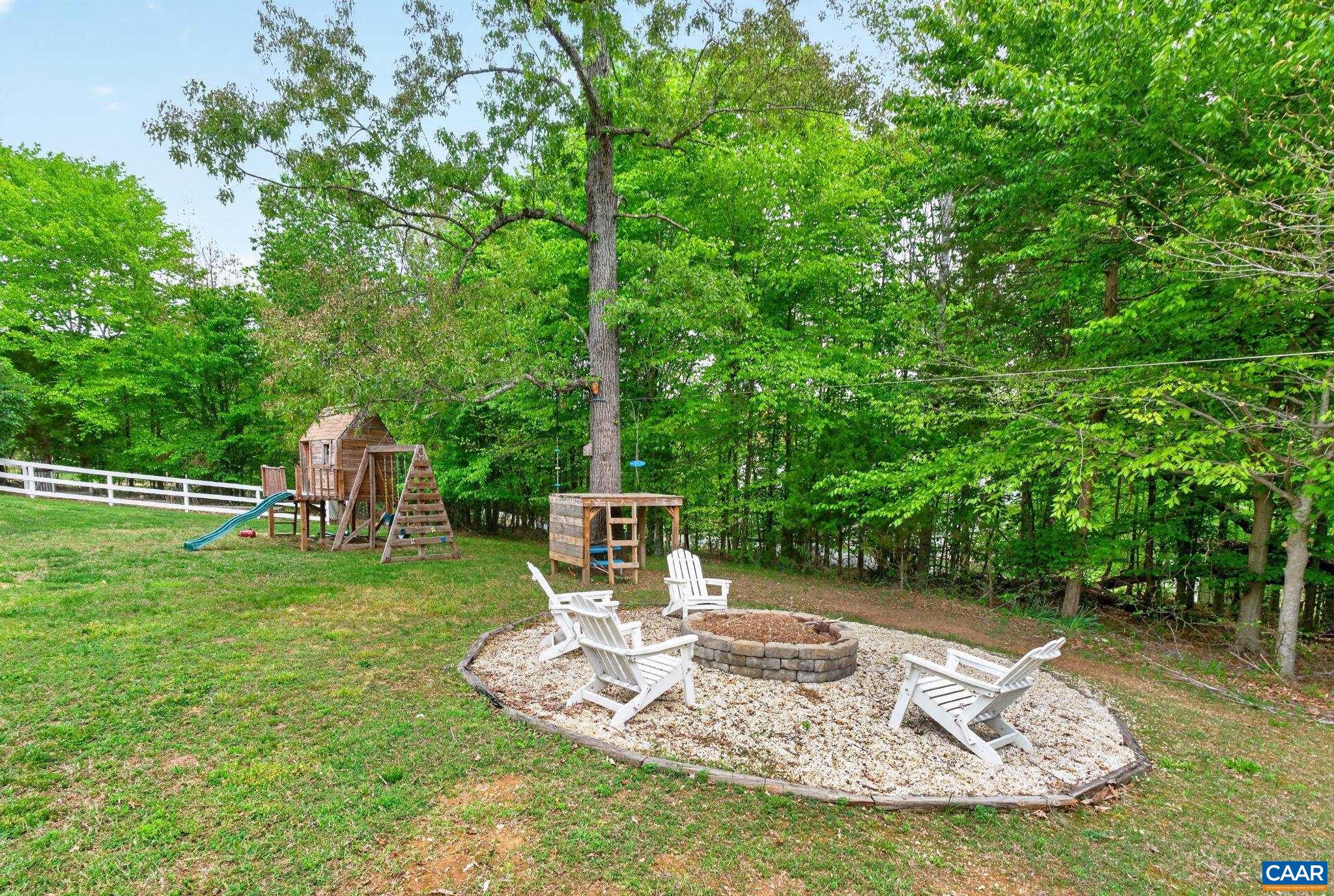 511 Taylor Ridge Way Palmyra, VA 22963 - Photo 45 of 57 a view of a table and chairs in the garden