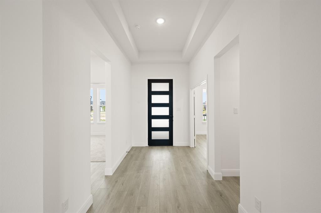 408 Dylan Way Midlothian, TX 76065 - Photo 12 of 40 a view of a hallway with wooden floor