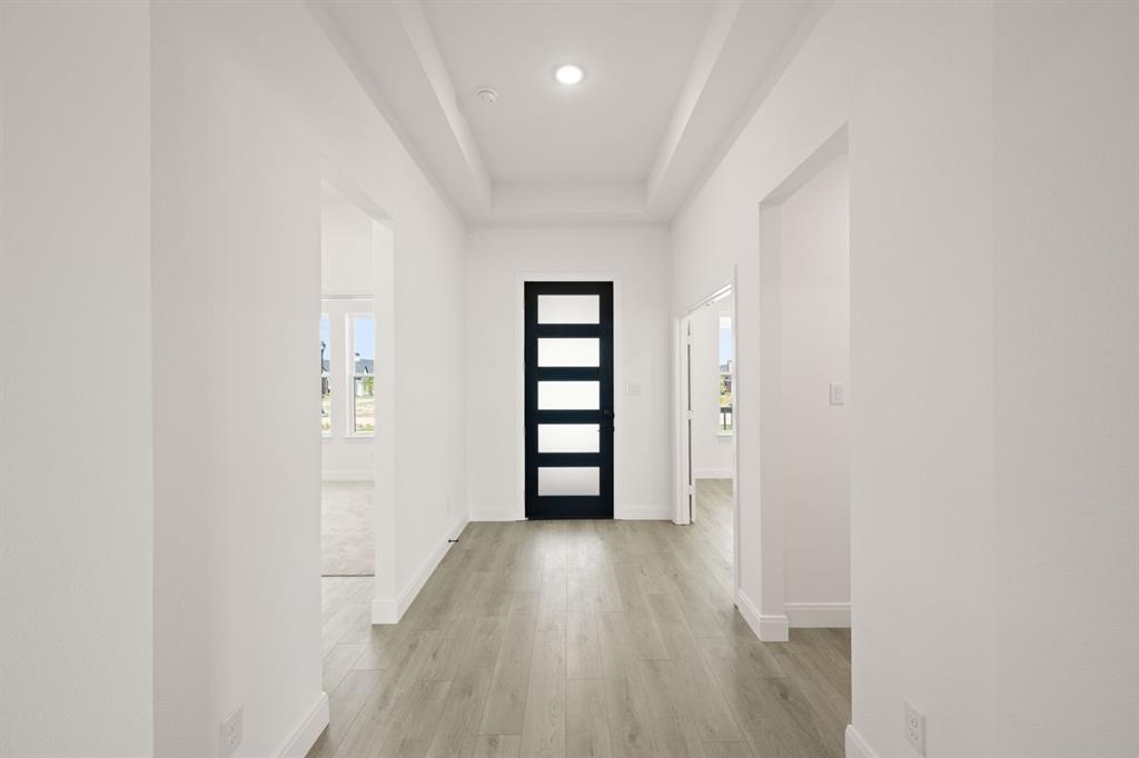 408 Dylan Way Midlothian, TX 76065 - Photo 15 of 40 a view of a hallway with wooden floor