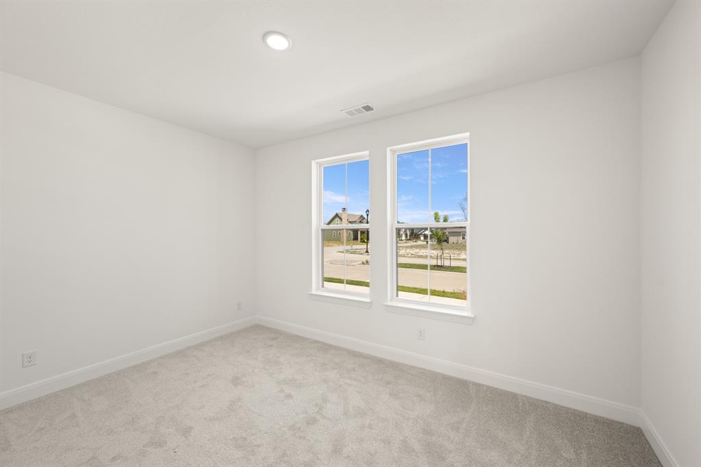408 Dylan Way Midlothian, TX 76065 - Photo 16 of 40 a view of an empty room with a window