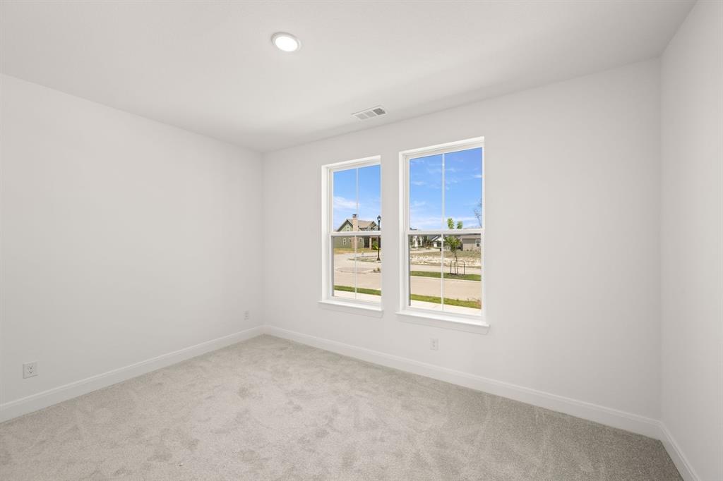 408 Dylan Way Midlothian, TX 76065 - Photo 19 of 40 a view of an empty room with a window