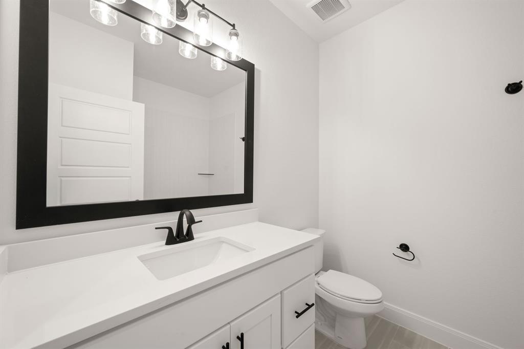 408 Dylan Way Midlothian, TX 76065 - Photo 24 of 40 a bathroom with a sink and a mirror