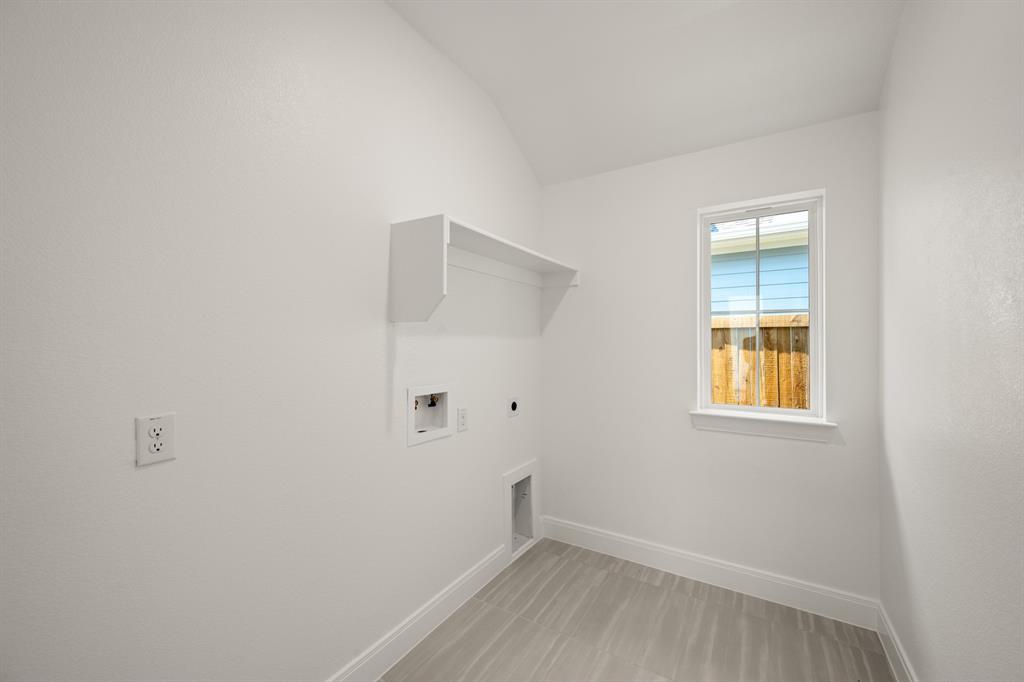 408 Dylan Way Midlothian, TX 76065 - Photo 32 of 40 a view of an empty room with wooden floor and a window