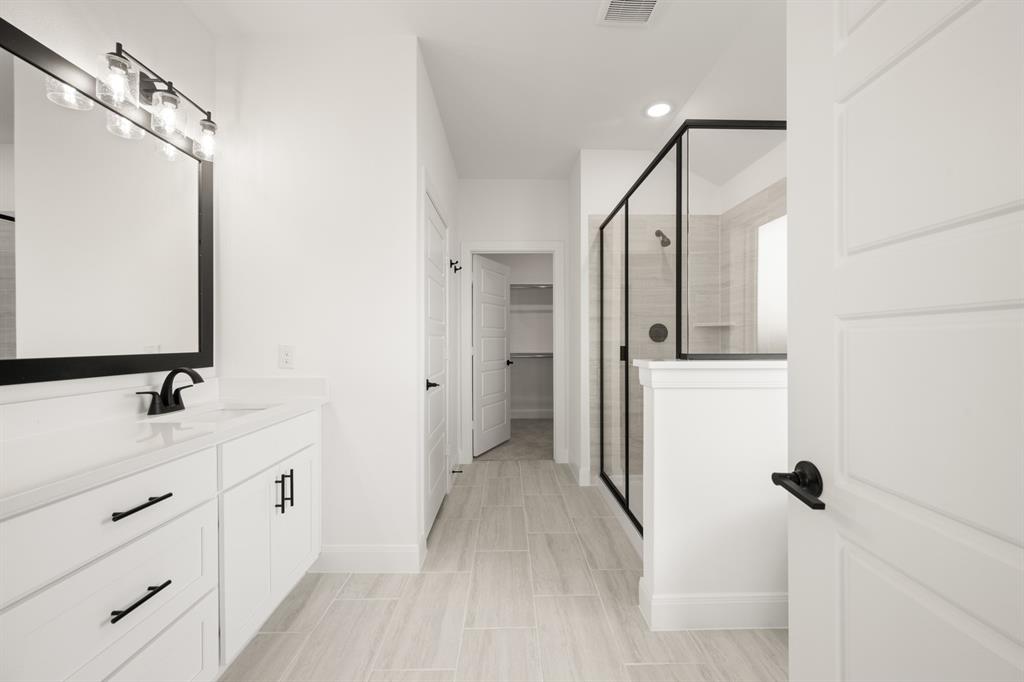 408 Dylan Way Midlothian, TX 76065 - Photo 35 of 40 a bathroom with a double vanity sink mirror and toilet
