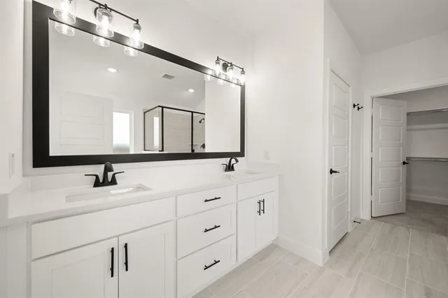 a white bath tub sitting next to a white sink