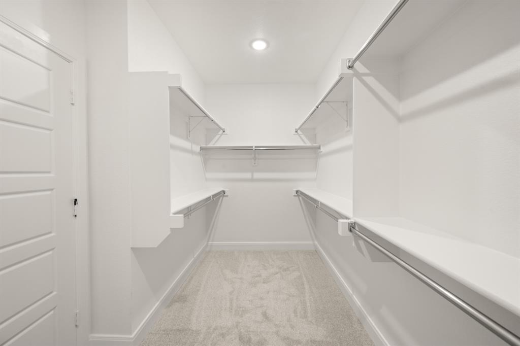 408 Dylan Way Midlothian, TX 76065 - Photo 39 of 40 a view of walk in closet with empty racks