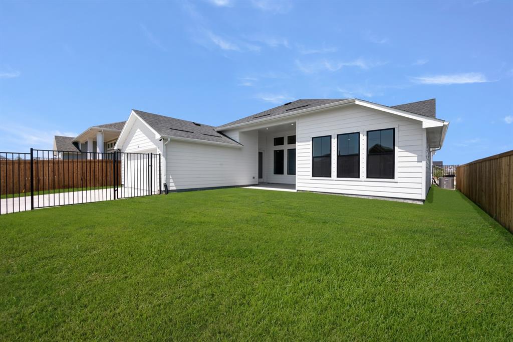 408 Dylan Way Midlothian, TX 76065 - Photo 7 of 40 a view of a house with a backyard