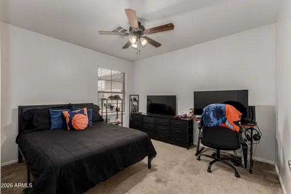 a bedroom with a bed and furniture
