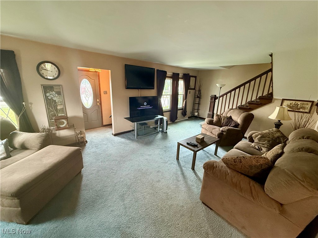 2614 Eldersville Road Follansbee, WV 26037 - Photo 10 of 18 Carpeted living room with stairs